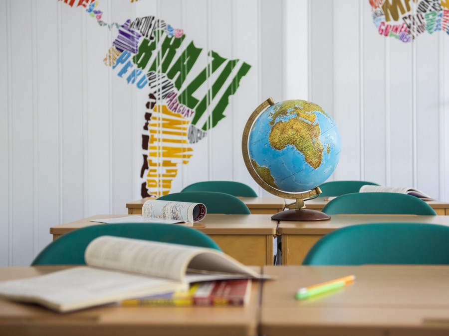 1-creative-beautiful-school-laboratory-interior-design-geography-classes-globe-handmade-acrylic-painted-world-map-bright-multi-colored-folding-doors-desks.jpeg